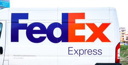 168000391 fedex express company logo on a delivery van side view closeup nobody fedex truck brand symbol